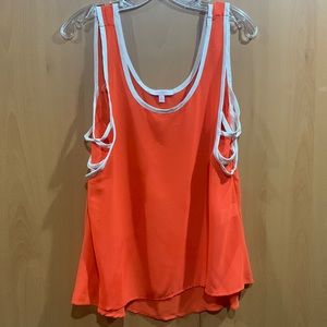 A super fun orange and white top by Margo & Sebastian